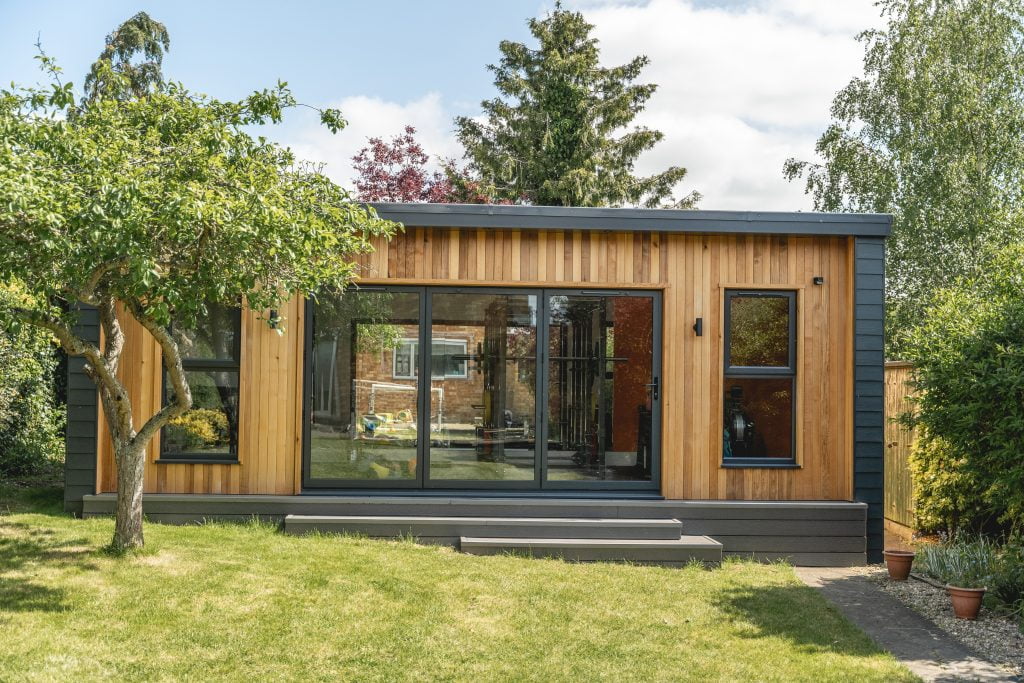 Front of Haon garden room gym with cedar cladding and large bifold doors