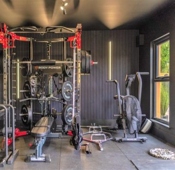 Inside garden gym with large weight lifting equipment